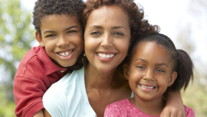 Mother With Children In Park