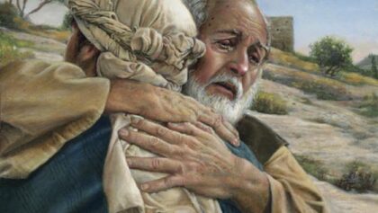 father embracing wayward child