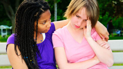 Teenager consoling her friend