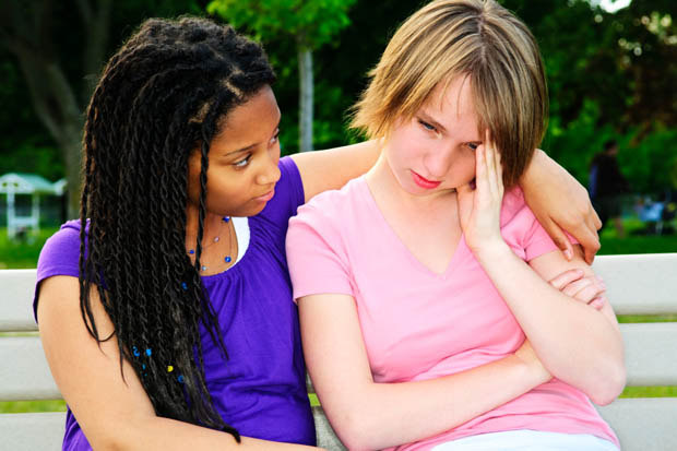 Teenager consoling her friend