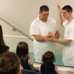 man being baptized