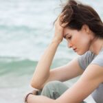 Sad and upset woman deep in thought