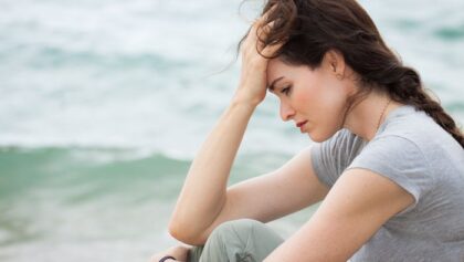 Sad and upset woman deep in thought